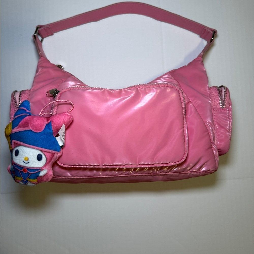 Pink faux patent leather handbag with Hello Kitty My Melody Dark Magician charm